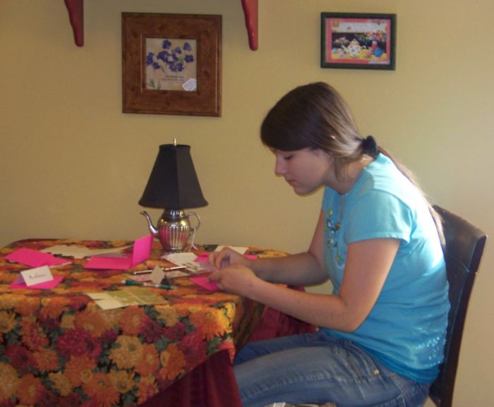 Brittany is writing her thank you notes to the many who attended her National American Miss Sponsor Tea, October 2008