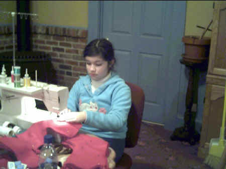 Brittany Gordon sewing together the Christmas stockings.